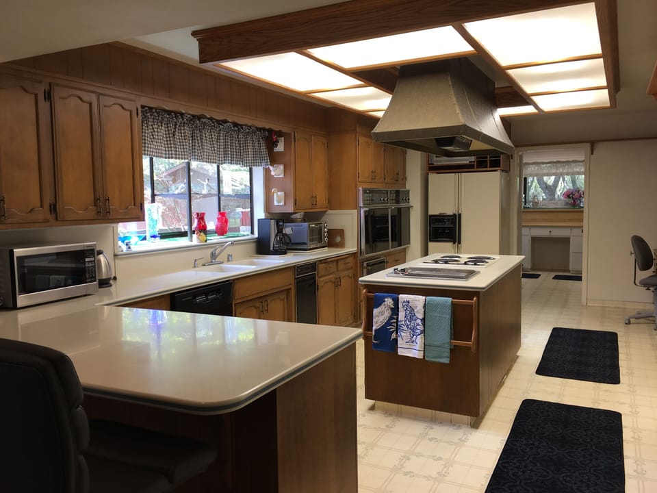 Kitchen with double ovens, warming drawer.
