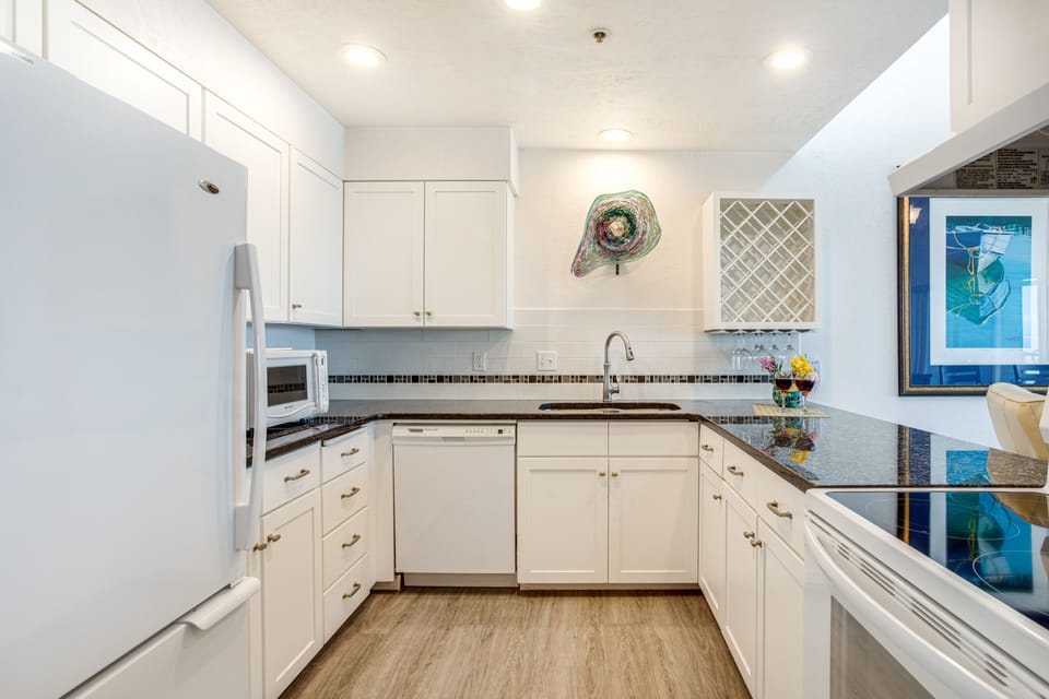 A spacious and modern kitchen provides top-flight appliances and ample cabinet space