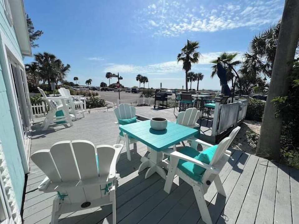 Large front deck with the beach across the street