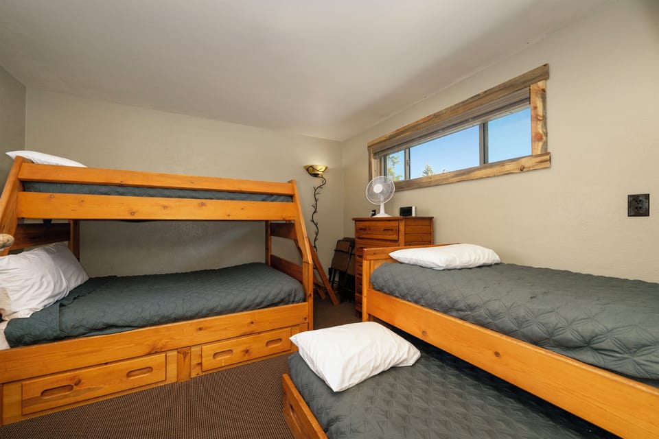 Your cozy bunk room with built-in storage and mountain light creates the perfect retreat for groups or families seeking adventure together.