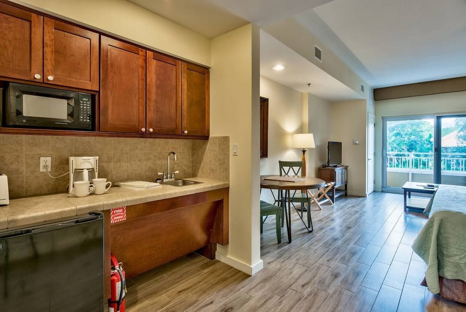 Hotel size fridge, microwave,  coffee machine.  "The place was really nice and super convenient to the beach with private access. The room was very clean and Kursad was a great host with tips and quick responses. Baytown Wharf was loads of fun also! 20th f