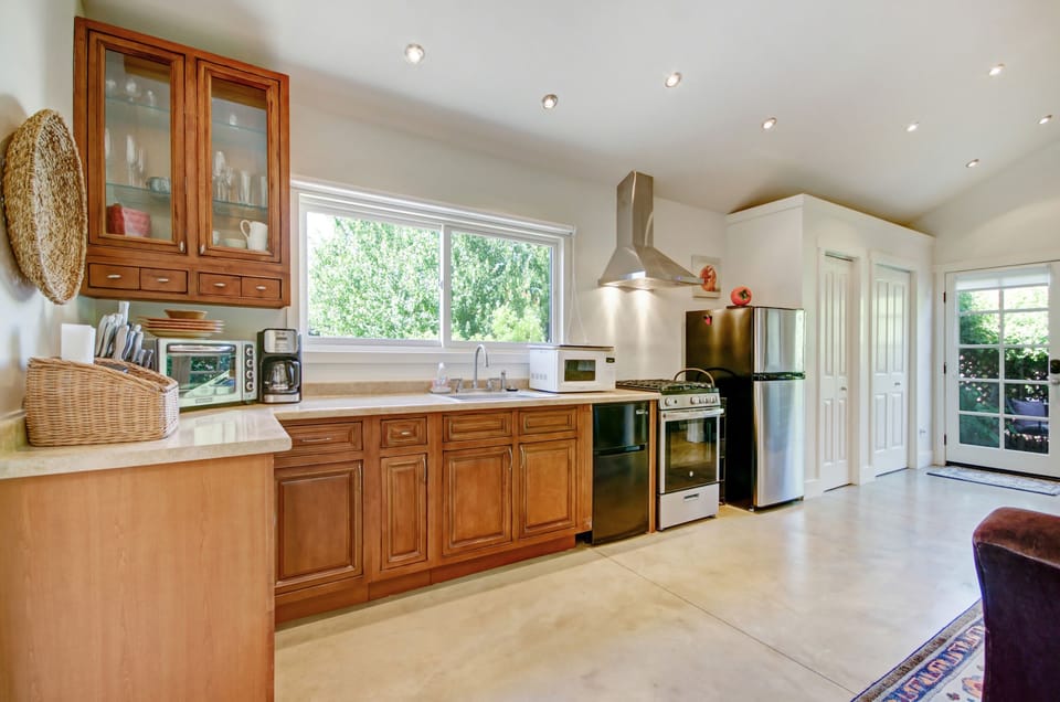 Kitchen with full stove and 1.5 refrigerators