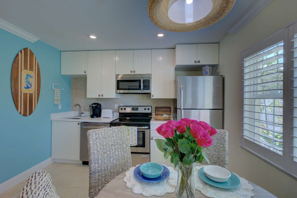 Small kitchen with a dishwasher and dining for 4.