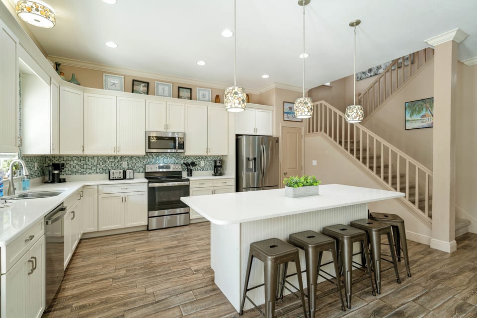 The kitchen is equipped with various appliances for a variety of cooking needs.