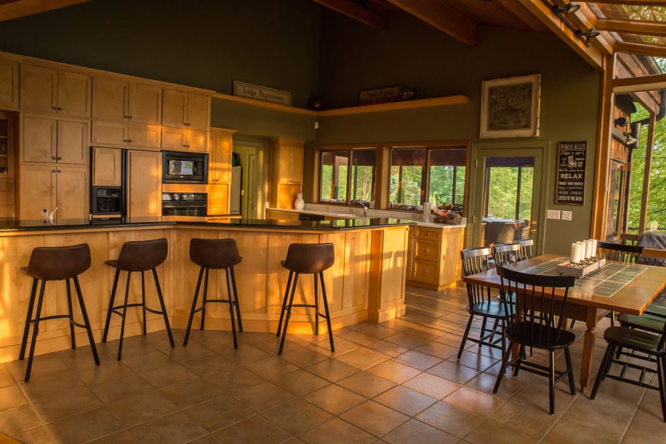 Huge central island in kitchen with seating for seven