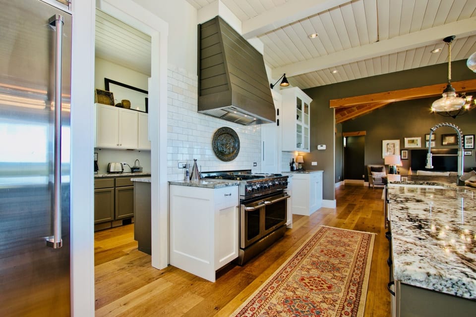 View of 48" pro range and a sneak peek into butler's pantry