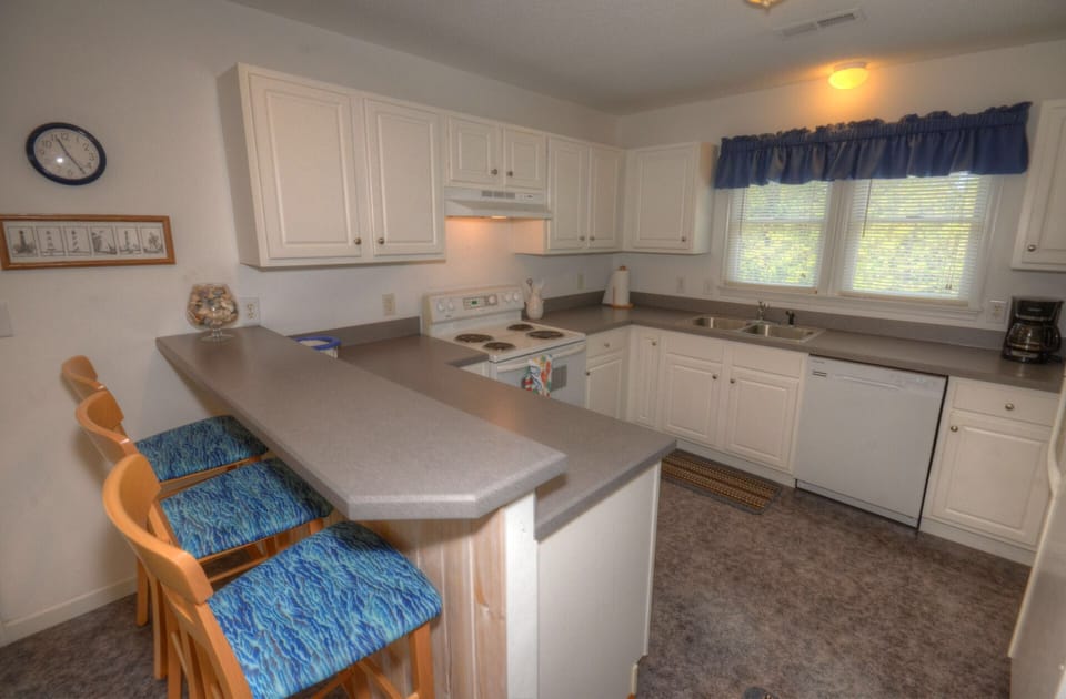 kitchen as been updated with new glass top stove/oven and new refrigerator.