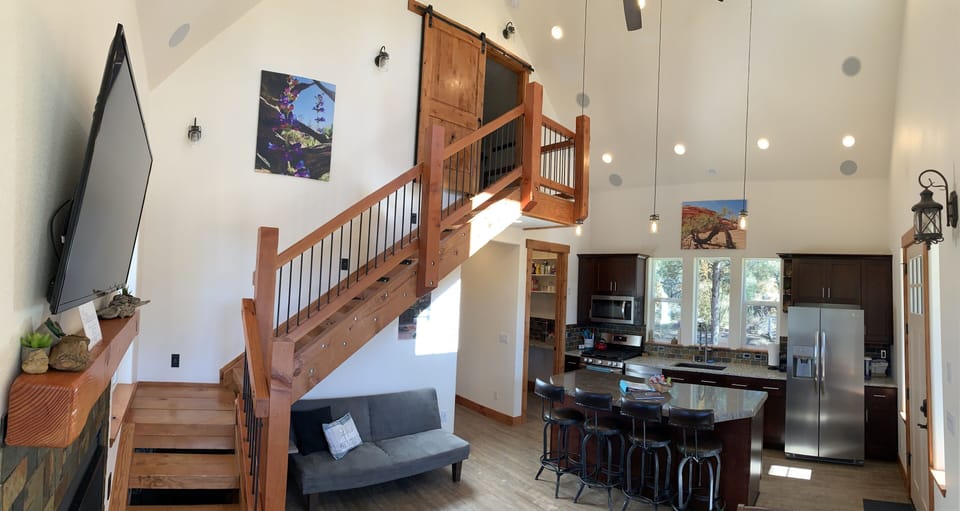 Great room TV, and stairs to loft
