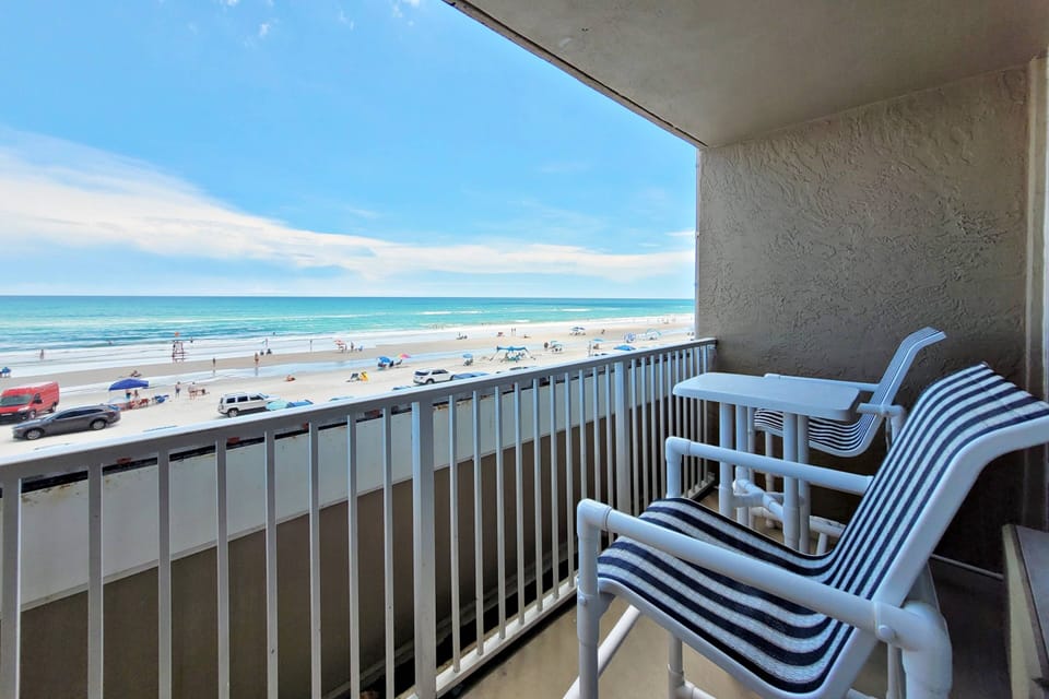Private balcony with high top seating and table.