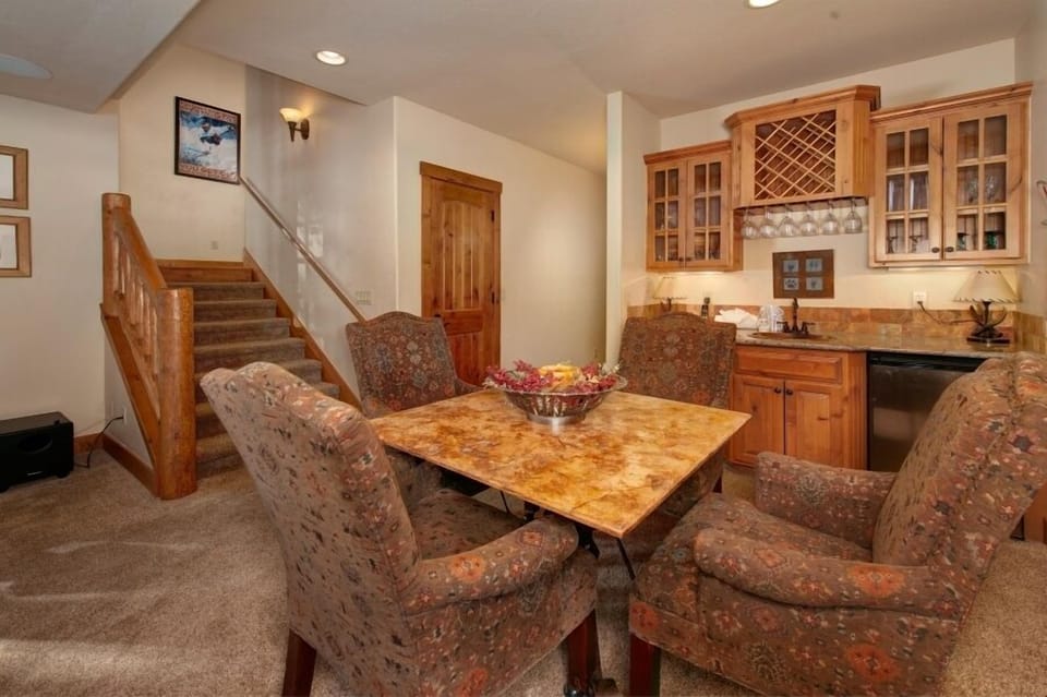 Lower level living area with gas fireplace, TV theater, wet bar and mini fridge.