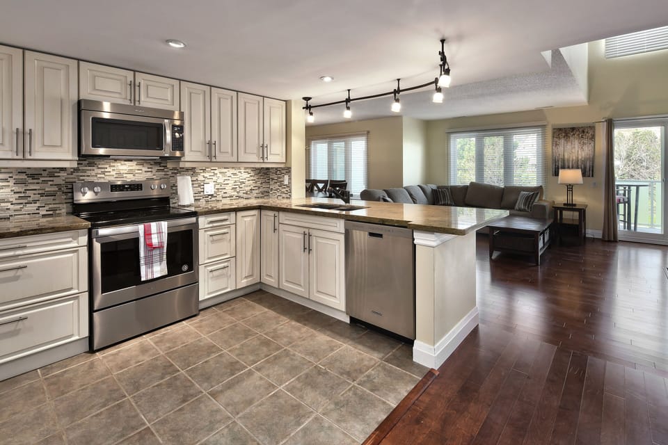 Fully stocked kitchen open to living/dining area