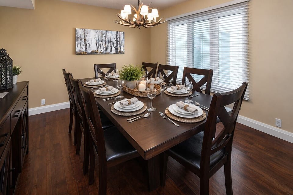 Large dining room includes high end furniture that comfortably seats 10