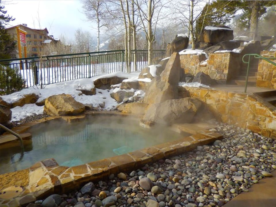 Four stone outdoor hot tubs available off of spa and gym area