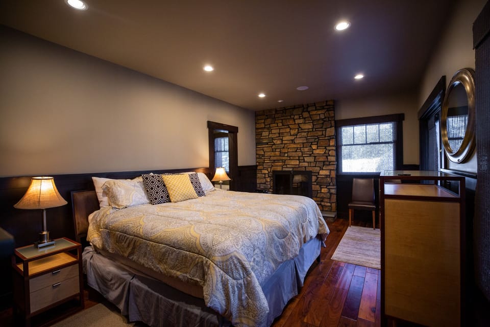 Master bedroom with french doors leading to porch with lake view.
