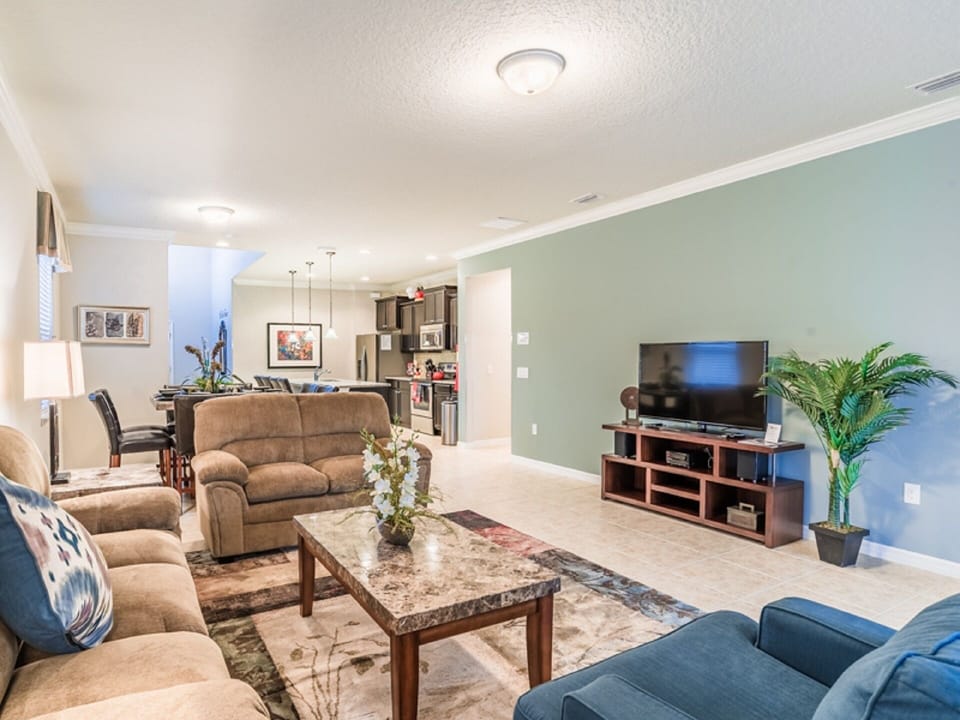 1st floor living room includes a 50" HDTV & Bluetooth CD/MP3 player stereo.