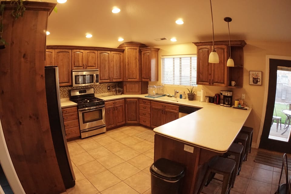 Fully stocked kitchen and breakfast bar, seats 4. 
