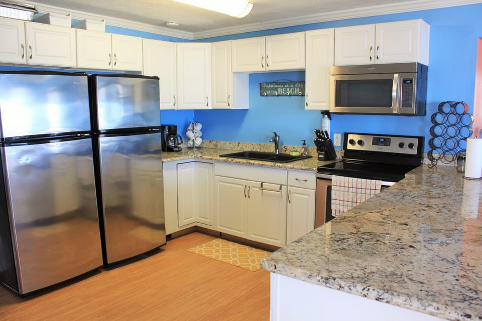 Kitchen - Stove, Microwave, 2 Refrigerators, & dishwasher