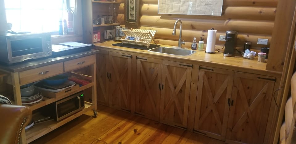 Convection oven, induction stovetop, microwave, coffee maker + UTC fridge.