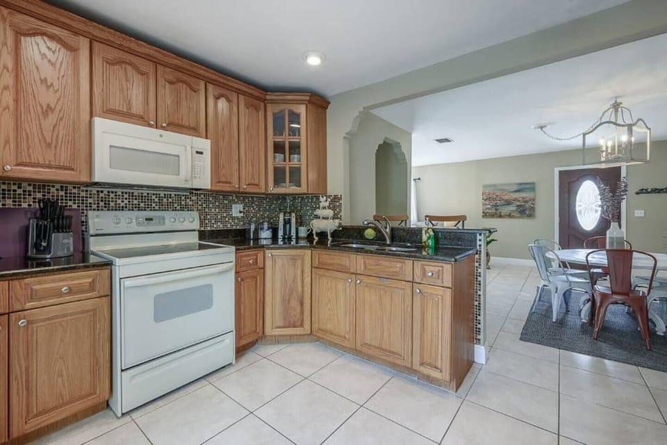 Kitchen Delight: Whip up culinary delights in this bright, spacious kitchen with modern finishes!