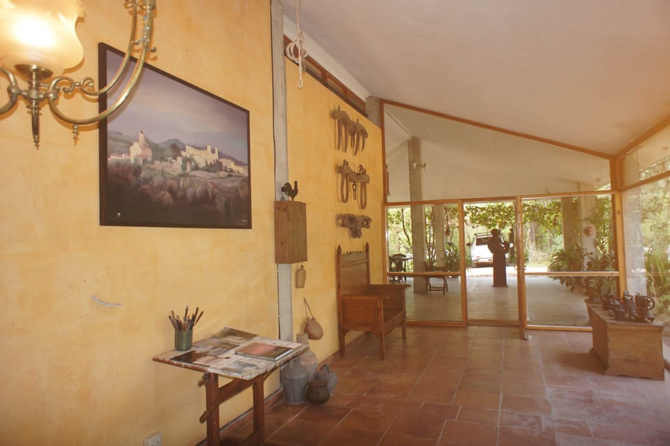 The main entrance of La Bruguera, with art and information on Casademont, the previous owner.