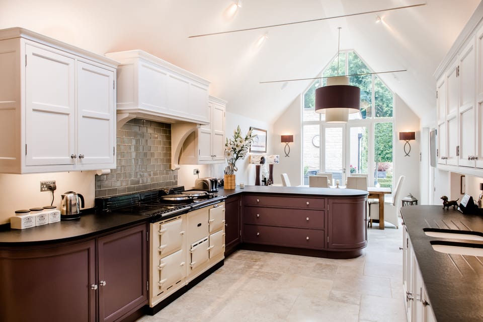 Fully equipped kitchen overlooking pool and hot tub terrace 