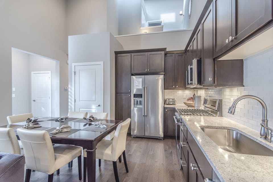 Kitchen - Granite counters, under cabinet lighting, washer and dryer in closet, and full size stainless steel appliances.
