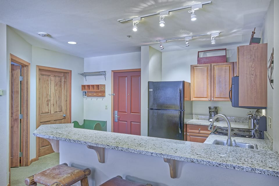 Kitchen - Granite counter tops, double sinks, and full size appliances.