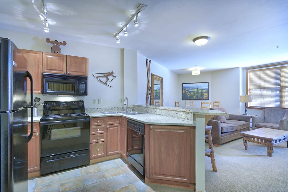 Kitchen - Well lit with upgraded track lighting.
