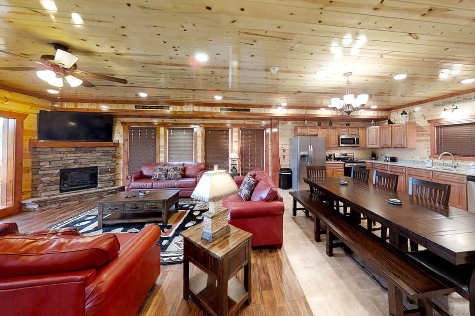 Experience the ultimate in comfort and style! This living room boasts plush seating, a warm stone electric fireplace, and stunning tongue and groove w