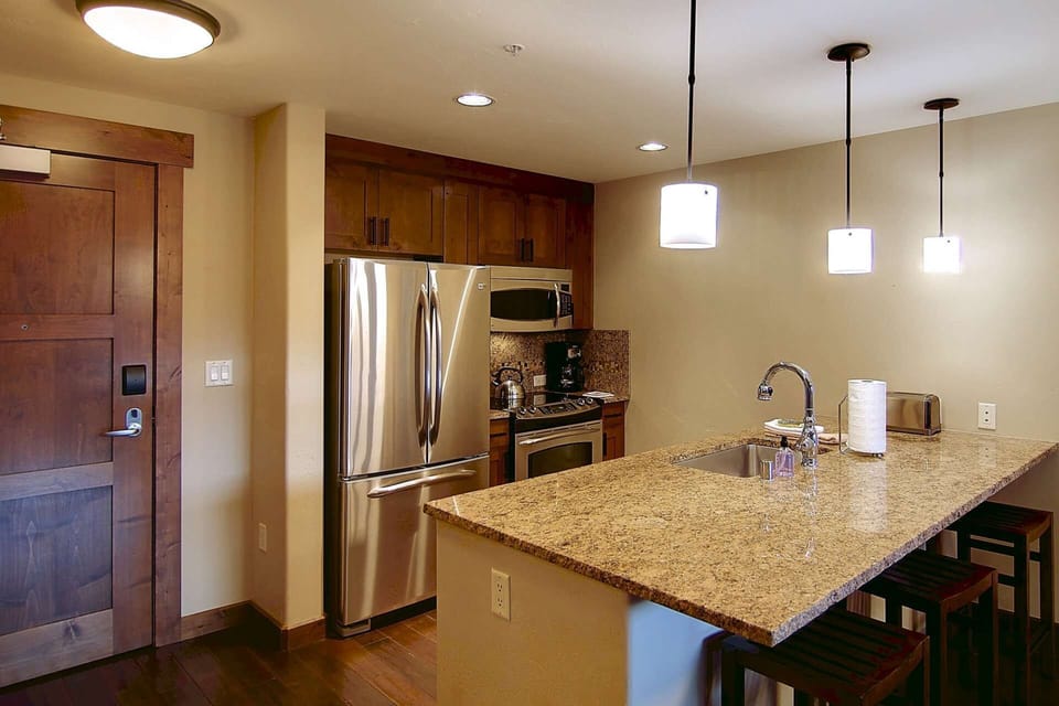 Bright kitchen with a bar area—perfect for cooking, casual dining, and socializing.