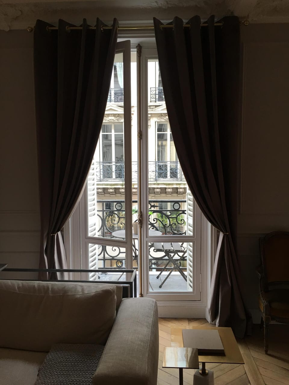 Balcony with seating to enjoy a quiet, authentic, Parisian street.