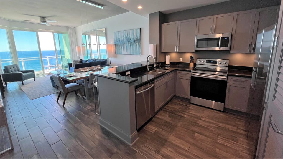 Our entire Penthouse has porcelain plank tile with the color of "driftwood"...