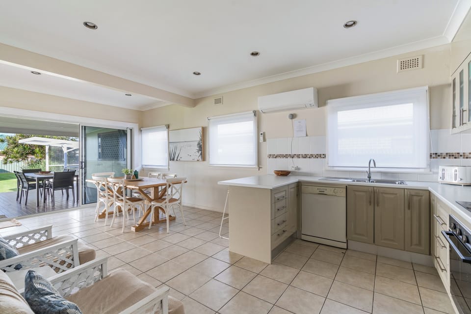 Bathroom with large shower and deep bathtub. Separate toilet next door.