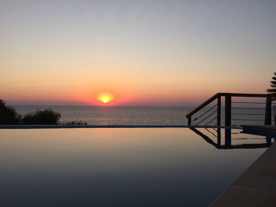 sunset by the pool