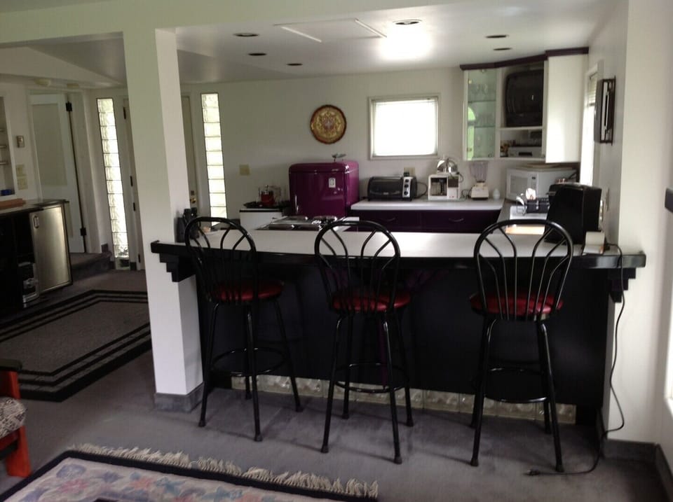 Kitchen with 3 stool lunch counter.