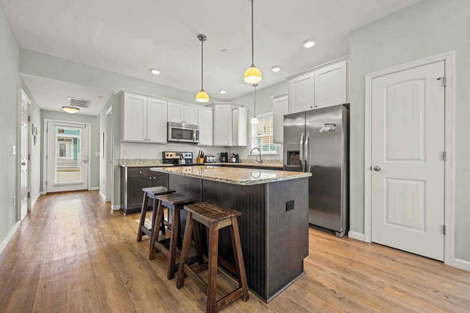 Kitchen with Bar Seating on First Level