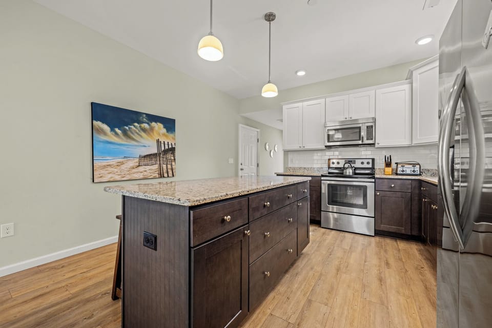 Kitchen with Bar Seating on First Level