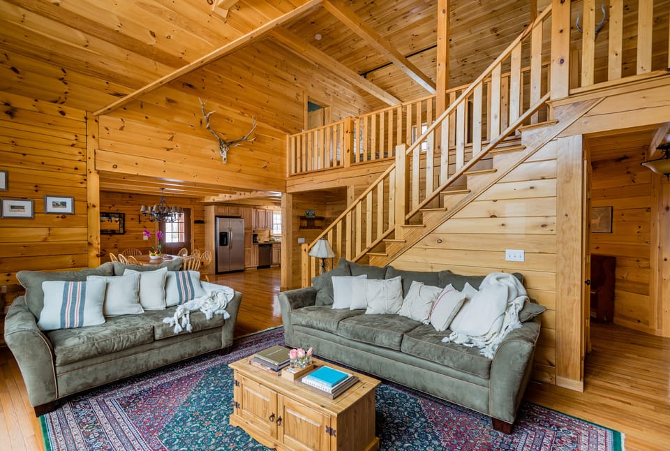 Livingroom with cathedral ceilings open to upstairs loft