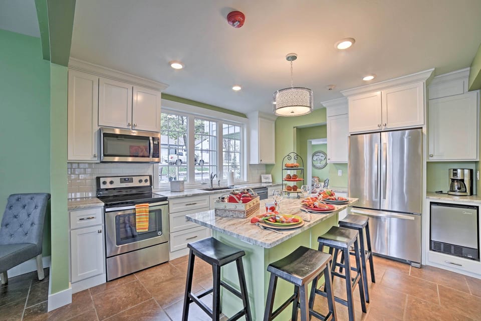 The fully equipped kitchen features stainless steel appliances.