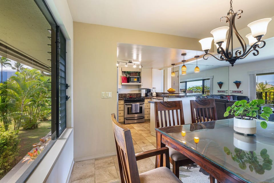 The oversize picture windows throughout the house maintain the open and airy feeling in every space. In the dining room you can enjoy views of the lush landscape with your meal.
