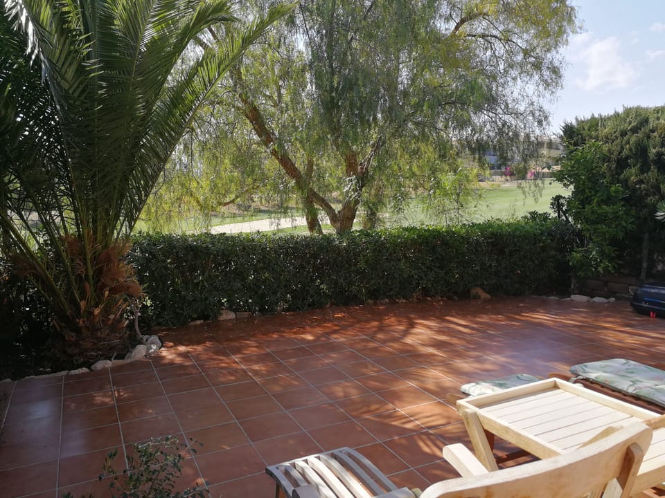 Large, tiled terrace overlooks the 13th fairway 