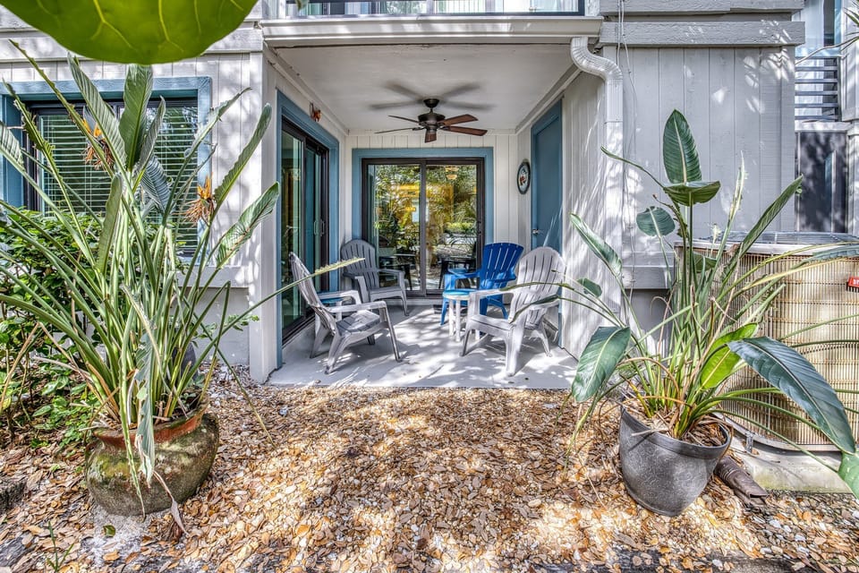 The back porch space with access from both the living room and the primary bedroom.
