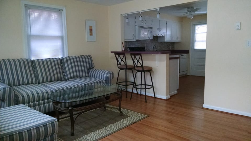 Living room with open floor plan into kitchen