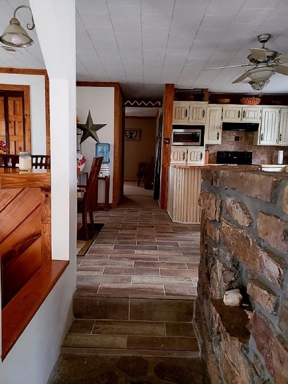 Step up from living room to kitchen