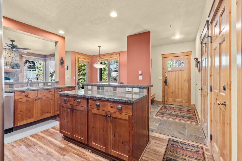 Full kitchen with stainless steel appliances.