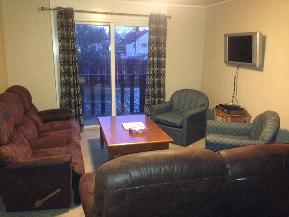 View of sitting area and sliding door to patio from entrance doorway.
