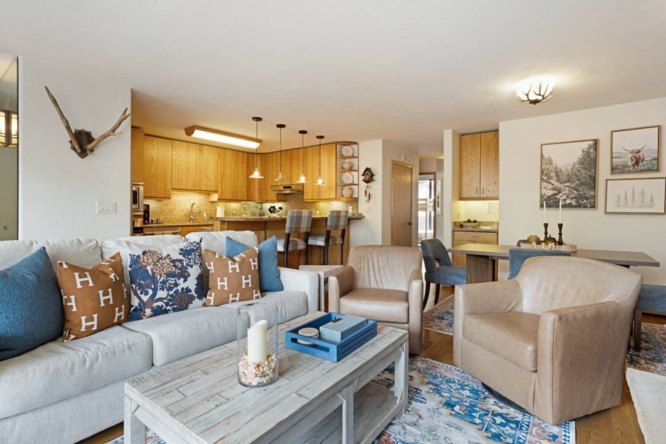 Relax on the plush sofa or swivel into a conversation in one of the stylish leather chairs.