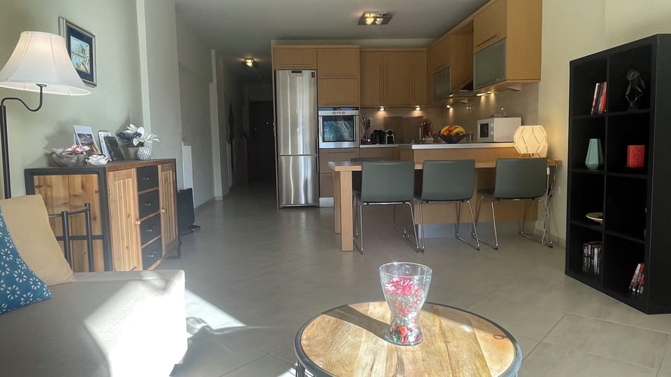 Large and modern, warm and cozy living room - open kitchen space view 