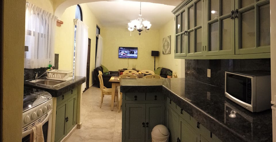 full kitchen, dishes, utensils, stove, microwave, washer/dryer