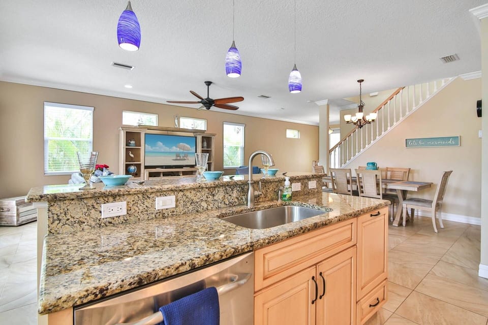 Beautiful custom kitchen with new stainless appliances, tile flooring and solid stone counters.